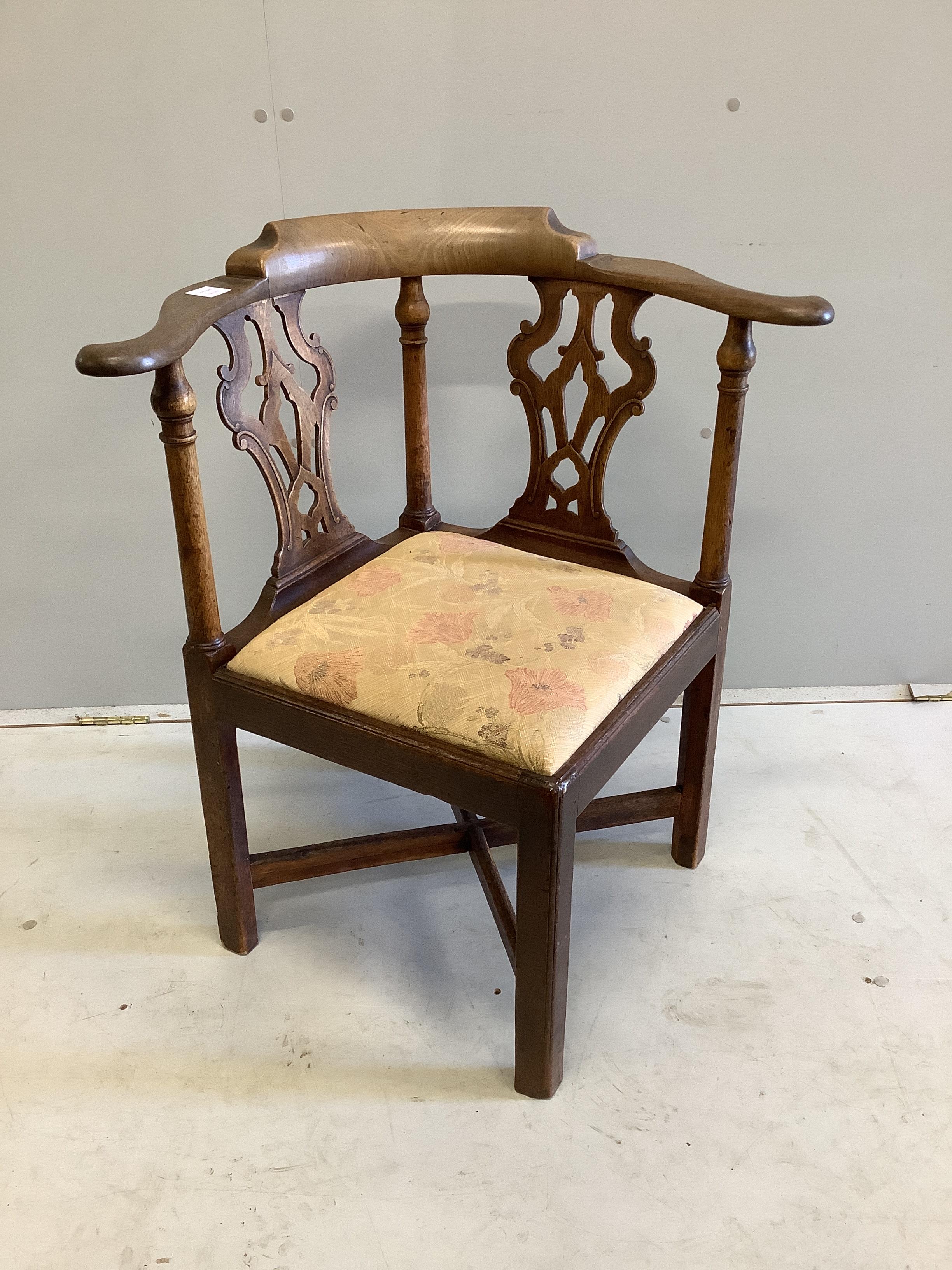 A George III mahogany corner elbow chair, width 73cm, depth 61cm, height 80cm